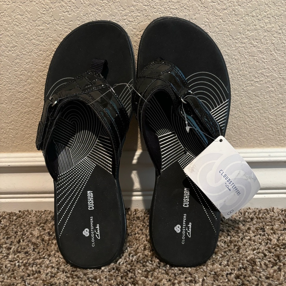 Black patent Cloudsteppers by Clark’s flip-flops